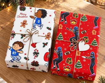 May include: Two rectangular gifts wrapped in paper. The left gift is white with cartoon football players, gingerbread men, and the text Merry Christmas. The right gift is red with football players, Christmas trees, and bells.