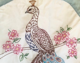 Vintage embroidered peacock quilt. Blue and white peacock quilt