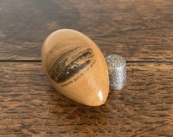 Antique Edwardian Mauchlineware egg with sterling silver thimble "Sandown Bay, Isle of Wight" c. early 20th century