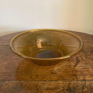 Antique amber coloured soda glass bowl with folded rim c. 18th or 19th century