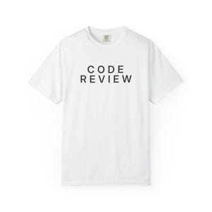 May include: A white short-sleeve t-shirt featuring the text CODE REVIEW printed in black capital letters across the chest. The shirt has a crew neckline and a standard fit, with a small brand label visible on the inside of the collar area.