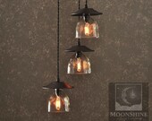The Serenity 3-Light Patron Tequila Bottle Chandelier With Customizable Metal Finish and Vintage Style Edison Lightbulbs