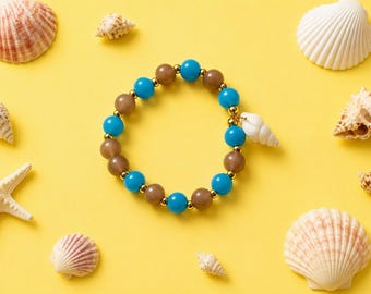 Expandable Beaded Bracelet with Seashell Charm – Blue, Beige, Gold Tones