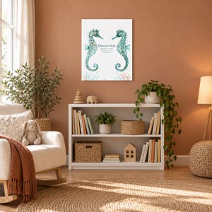Seahorse reef canvas in a nursery on a terracotta wall above a white bookshelf, showing sample name Eleanor Mae and birth details.