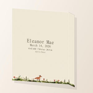Angled close view of woodland personalized baby birth stats canvas showing the printed wrapped edge.