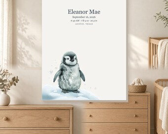 May include: A rectangular wall art print featuring a watercolor illustration of a fluffy gray penguin standing on a snowy mound. The text reads Eleanor Mae, September 16, 2026, 6:42 AM, 7 lb 4 oz, 20.5 in, and AUSTIN, TEXAS.
