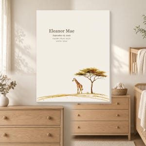 May include: A rectangular wall art print on a cream background featuring a watercolor illustration of a giraffe standing under an acacia tree. The text reads Eleanor Mae, September 16, 2026, 6:42 AM, 7 lb 4 oz, 20.5 in, and Austin, Texas.