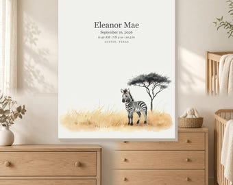 May include: A rectangular wall art print featuring a watercolor illustration of a zebra standing in tall golden grass beneath a single tree. The text reads: Eleanor Mae, September 16, 2026, 6:42 AM, 7 lb 4 oz, 20.5 in, AUSTIN, TEXAS.