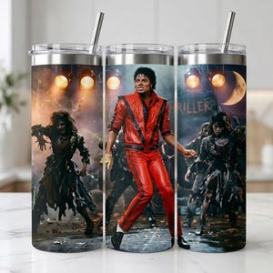 May include: A cylindrical stainless steel tumbler with a clear lid and metal straw, featuring a wrap-around graphic of Michael Jackson in a red leather jacket and pants, surrounded by zombie figures in a dark, stage-lit setting with the word THRILLER.