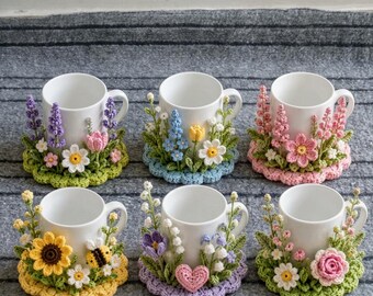 May include: Six white ceramic mugs, each featuring a unique crochet floral arrangement around the base. The designs include various colorful flowers like sunflowers, daisies, roses, and a small bee, all crafted with intricate yarn details.