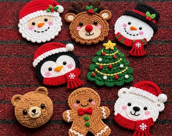 May include: A collection of eight crocheted Christmas ornaments featuring a Santa Claus, a reindeer, a snowman with a black hat, a penguin in a red scarf, a green Christmas tree, a brown bear, a gingerbread person, and a polar bear in a red scarf.