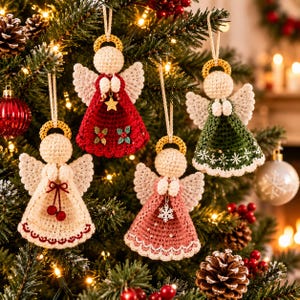 May include: Four crocheted angel ornaments hanging from a tree. One is red with a gold star, one is green with white snowflakes, one is cream with red berries, and one is dusty pink with a white snowflake charm. Each has a gold halo and wings.