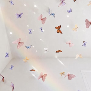 Guirnalda de mariposas: móvil de papel hecho a mano, decoración para guardería y fiestas. imagen 2