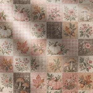May include: A fabric featuring a repeating patchwork grid pattern with autumn-themed illustrations. The squares display pumpkins, mushrooms, maple leaves, acorns, and floral arrangements in muted shades of pink, brown, orange, and cream.