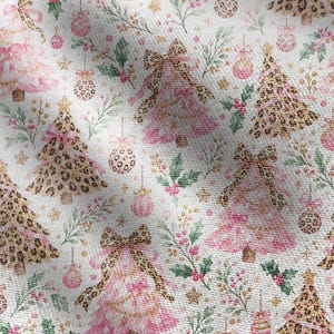 May include: A white fabric featuring a repeating pattern of Christmas trees and ornaments. The design includes pink and leopard print trees adorned with bows, interspersed with pink and leopard print baubles, green holly leaves, and small gold stars.