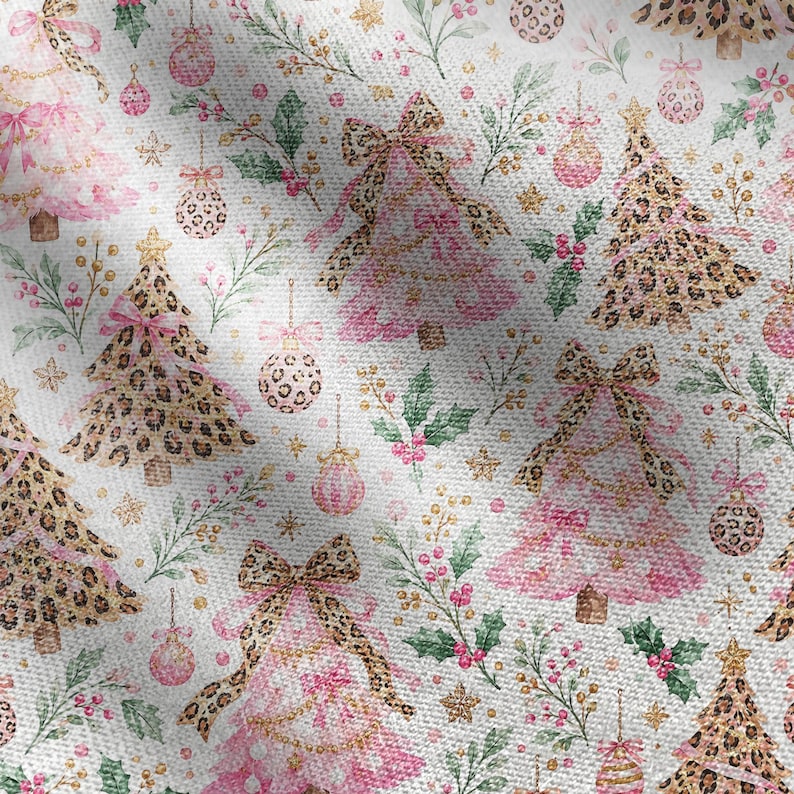 May include: A white fabric featuring a repeating pattern of Christmas trees and ornaments. The design includes pink and leopard print trees adorned with bows, interspersed with pink and leopard print baubles, green holly leaves, and small gold stars.
