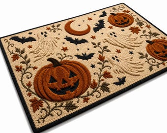 May include: A rectangular doormat with a cream-colored background featuring a pattern of orange jack-o'-lanterns, white ghosts, black bats, a crescent moon, small stars, and brown autumn leaves, all framed by a solid black border.