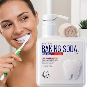 May include: A white square pump bottle of Upgrade Baking Soda Multi-White Toothpaste. The label features blue and red text, a tooth icon, and states 10.5 FL OZ/300g. The bottle is positioned next to a green and white toothbrush with toothpaste.