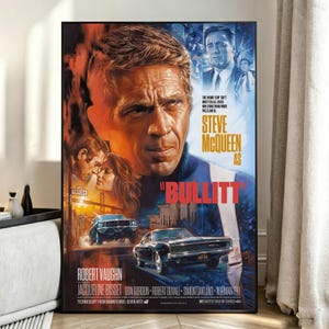 May include: A movie poster for Bullitt featuring a large portrait of Steve McQueen, smaller portraits of Robert Vaughn and Jacqueline Bisset, and a black car driving on a city street. The text reads Steve McQueen as Bullitt and lists cast names.