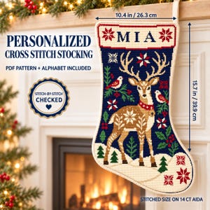 May include: A cross stitch Christmas stocking featuring a deer, birds, and holly on a dark blue background with the name MIA at the top. The stocking measures 10.4 inches wide by 15.7 inches high. Text includes PERSONALIZED CROSS STITCH STOCKING.