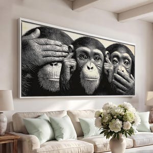May include: A rectangular wall art print featuring a black and white illustration of three chimpanzees. The first monkey covers its eyes, the second covers its ears, and the third covers its mouth, representing the three wise monkeys concept.