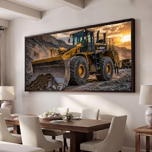 May include: A rectangular wall art print featuring a yellow Komatsu WA600 wheel loader operating in a rocky quarry at sunset. The heavy construction vehicle is shown in profile with large treaded tires, a front blade, and a cab.
