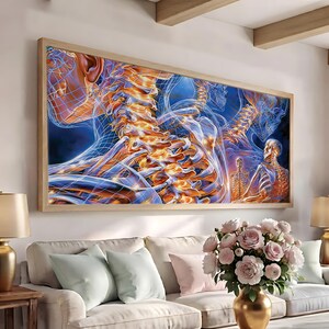May include: A rectangular wall art piece featuring a digital illustration of human anatomy. The artwork displays glowing orange and yellow spinal columns and skeletal structures overlaid with blue wireframe grids against a dark blue background.
