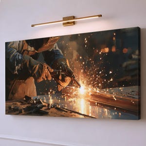 May include: A rectangular canvas wall art print depicting a welder wearing protective gear and gloves, using a torch to cut metal. The scene features bright orange sparks flying from the point of contact, set against a dark, industrial background.