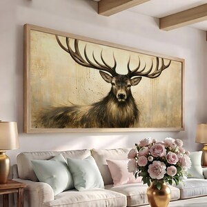 May include: A large rectangular wall art piece featuring a detailed painting of a majestic stag with expansive antlers. The deer is rendered in shades of brown and tan against a textured, neutral-toned background with subtle vertical paint drips.