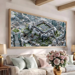 May include: A rectangular wall art piece in a light wood frame depicting a futuristic cityscape. The central focus is a large, complex technological structure resembling a computer processor, surrounded by tall, detailed buildings and greenery.