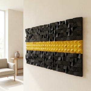 May include: A rectangular wall art piece composed of numerous small, individual wooden blocks arranged in a grid. The blocks are finished in black, with a single horizontal row of blocks finished in a bright yellow, creating a textured surface.