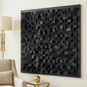 May include: A large square wall art piece composed of numerous small, rectangular black wooden blocks arranged in a textured, three-dimensional grid pattern. The blocks vary in depth and orientation, creating a complex, layered surface.