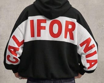 Schwarzer California Hoodie mit rotem Puffprint-Farbblock-Design, Oversize-Schnitt mit Reißverschluss und zum Überziehen, Unisex-Streetwear der Westküste