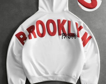 Brooklyn Hoodie, weiß, mit rotem 3D-Print auf der Rückseite, Oversized-Pullover-Hoodie, Unisex-Hoodie im New Yorker Streetwear-Stil