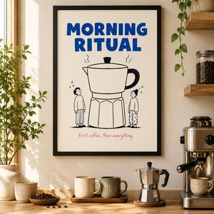 May include: A framed wall art print featuring the text MORNING RITUAL in blue, a large black and white line drawing of a moka pot, two small figures standing on either side, and the text First coffee, then everything. in pink at the bottom.