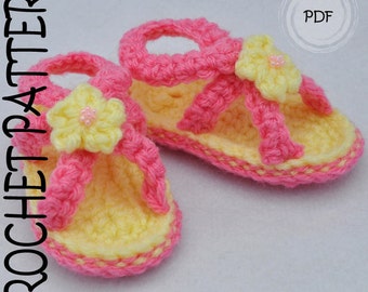 May include: Handmade crochet baby sandals in yellow and pink. The sandals have a flower detail and the text "CROCHET PATTERN" and "PDF". The sandals are a soft, colourful design.