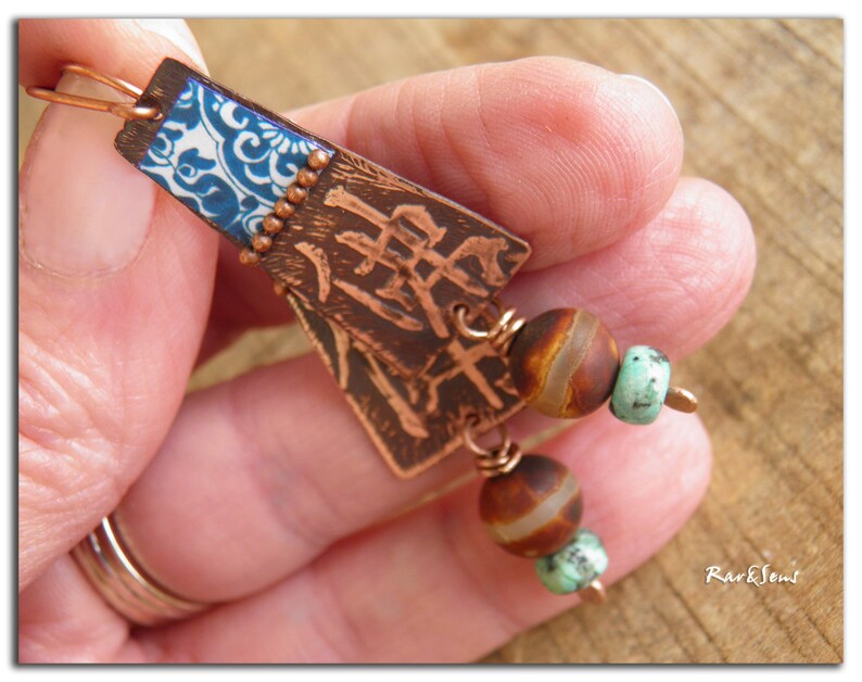 May include: Copper earrings with blue and white patterned metal, brown and white agate beads, and turquoise beads.