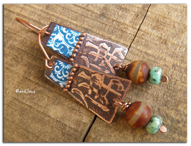 May include: Copper earrings with blue and white patterned squares, brown and white agate beads, and turquoise beads.