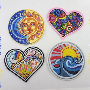 May include: Four embroidered patches with colorful designs. One patch features a sun and moon, another a heart with floral patterns, a heart with a sun and moon, and a round patch with a sun over ocean waves. The patches have a variety of colors.