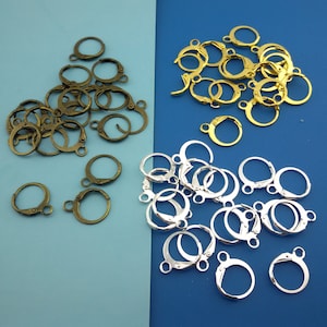 May include: A collection of gold and silver jump rings. The jump rings are a popular jewelry making supply.