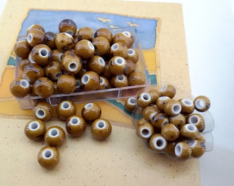 brown ceramic beads,bulk price blue big hole ceramic beads,light brown ceramic bead,beige ceramic glazed bead,black splashed porcelain beads