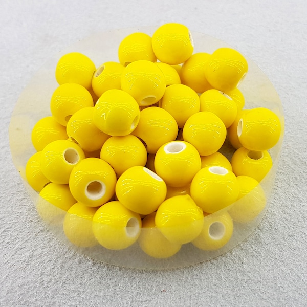 pottery beads,yellow ceramic beads,yellow  porcelain beads,round porcelain yellow beads,yellow glazed beads,glazed porcelain small beads