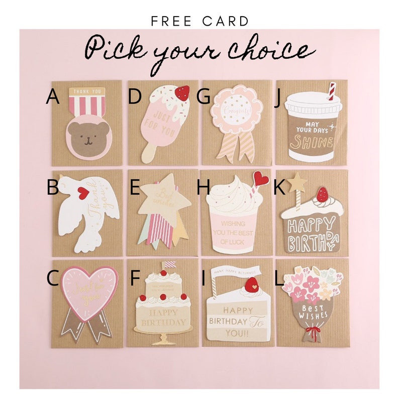 May include: A set of 12 greeting cards with different designs. The cards are all brown with a white border and feature various illustrations, including a bear, a bird, a cupcake, a cake, a star, a heart, a flower bouquet, and a coffee cup. The cards are all labeled with letters from A to L.