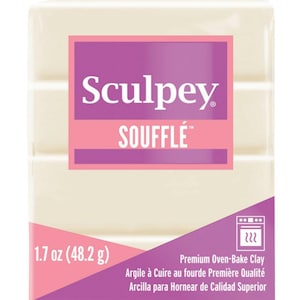 May include: A 1.7 ounce (48.2 gram) block of Sculpey Souffle brand oven-bake clay. The clay is white and is packaged in a pink and white box with the brand name and product name printed on it.