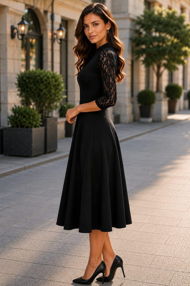 Puede incluir: Un vestido midi negro con mangas de encaje de tres cuartos, un corpi&ntilde;o ajustado y una falda acampanada. La prenda tiene un cuello alto y se combina con zapatos de tac&oacute;n negros. El vestido es de color negro s&oacute;lido con detalles de encaje floral.