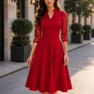 Puede incluir: Un vestido midi de color rojo vibrante con escote en V y cuello peque&ntilde;o, mangas tres cuartos con detalles de encaje intrincados y una falda acampanada que cae por debajo de las rodillas. El corpi&ntilde;o es ajustado y se une a una falda amplia.