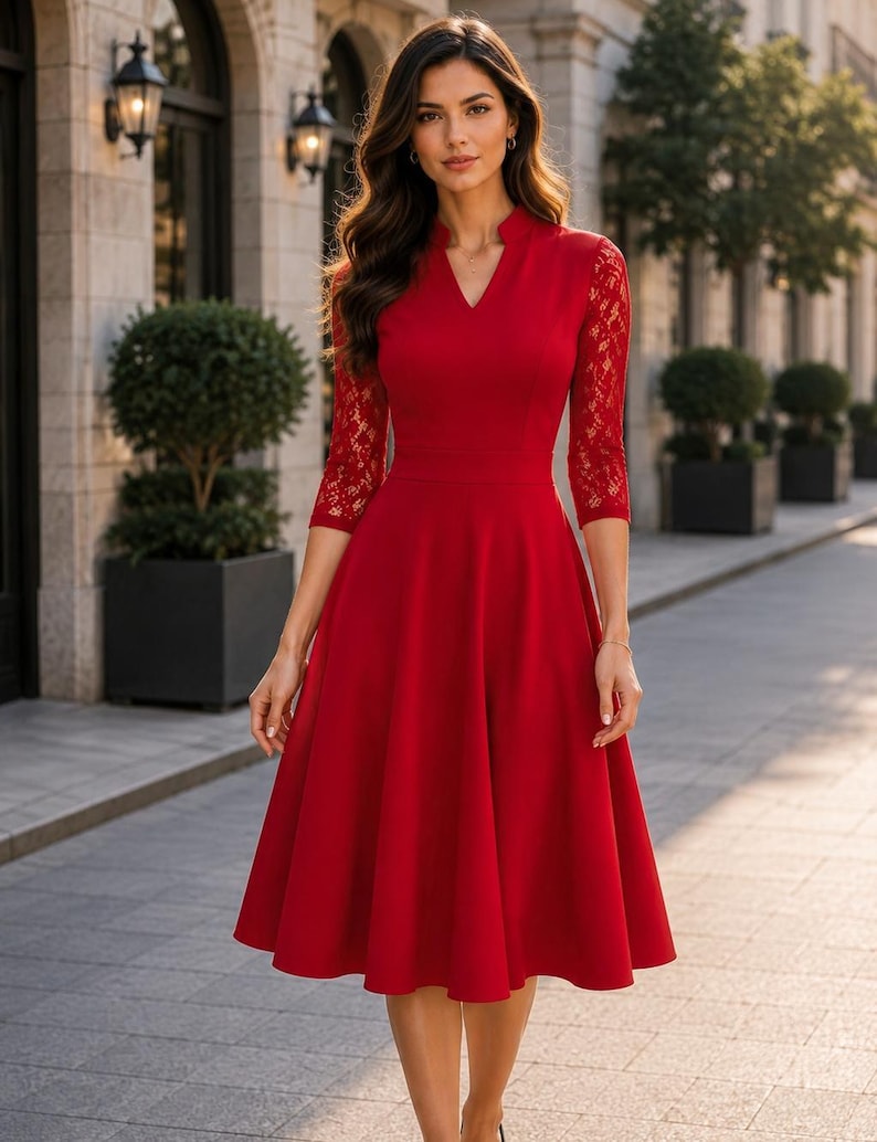 Puede incluir: Un vestido midi de color rojo vibrante con escote en V y cuello peque&ntilde;o, mangas tres cuartos con detalles de encaje intrincados y una falda acampanada que cae por debajo de las rodillas. El corpi&ntilde;o es ajustado y se une a una falda amplia.