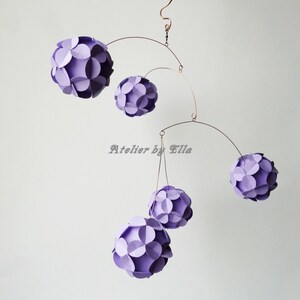 hanging mobile in lavender colors, five paper balls each made of 12 flower shape paper pieces, size of a mobile is as a basket ball size