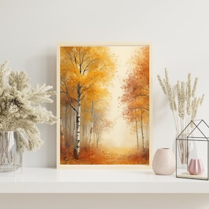Può includere: Una stampa artistica da parete verticale incorniciata che raffigura una scena boschiva in autunno. Il dipinto presenta betulle con tronchi bianchi e foglie giallo oro, su uno sfondo morbido e nebbioso con un sottobosco arancione e marrone.