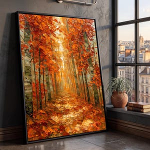 Könnte beinhalten: Ein rechteckiges gerahmtes Wandbild mit einem Ölgemälde eines Waldwegs im Herbst. Die Szene zeigt hohe Bäume mit leuchtend orangefarbenem und rotem Laub, wobei eine dicke Schicht aus herabgefallenen Blättern den Boden in warmen Tönen bedeckt.